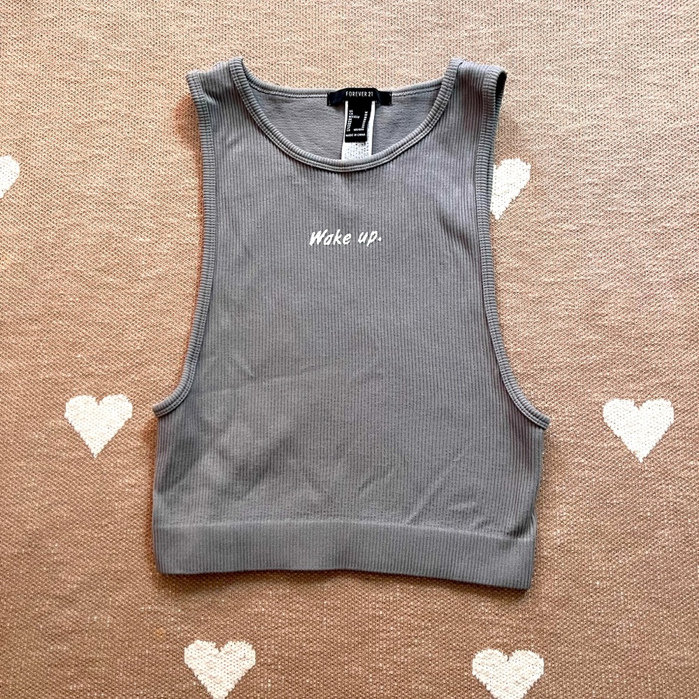 this item is a stretchy ribbed tank top from forever 21 in a size M